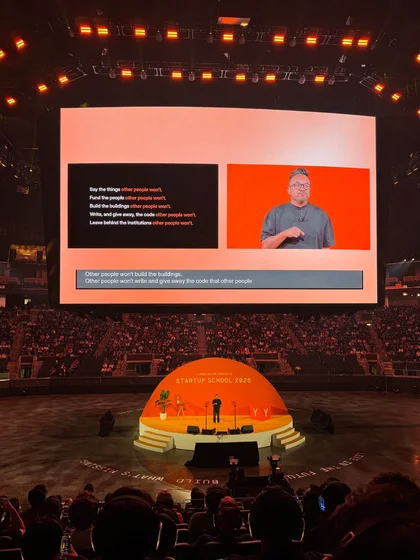 Y Combinator Startup School stage during a talk